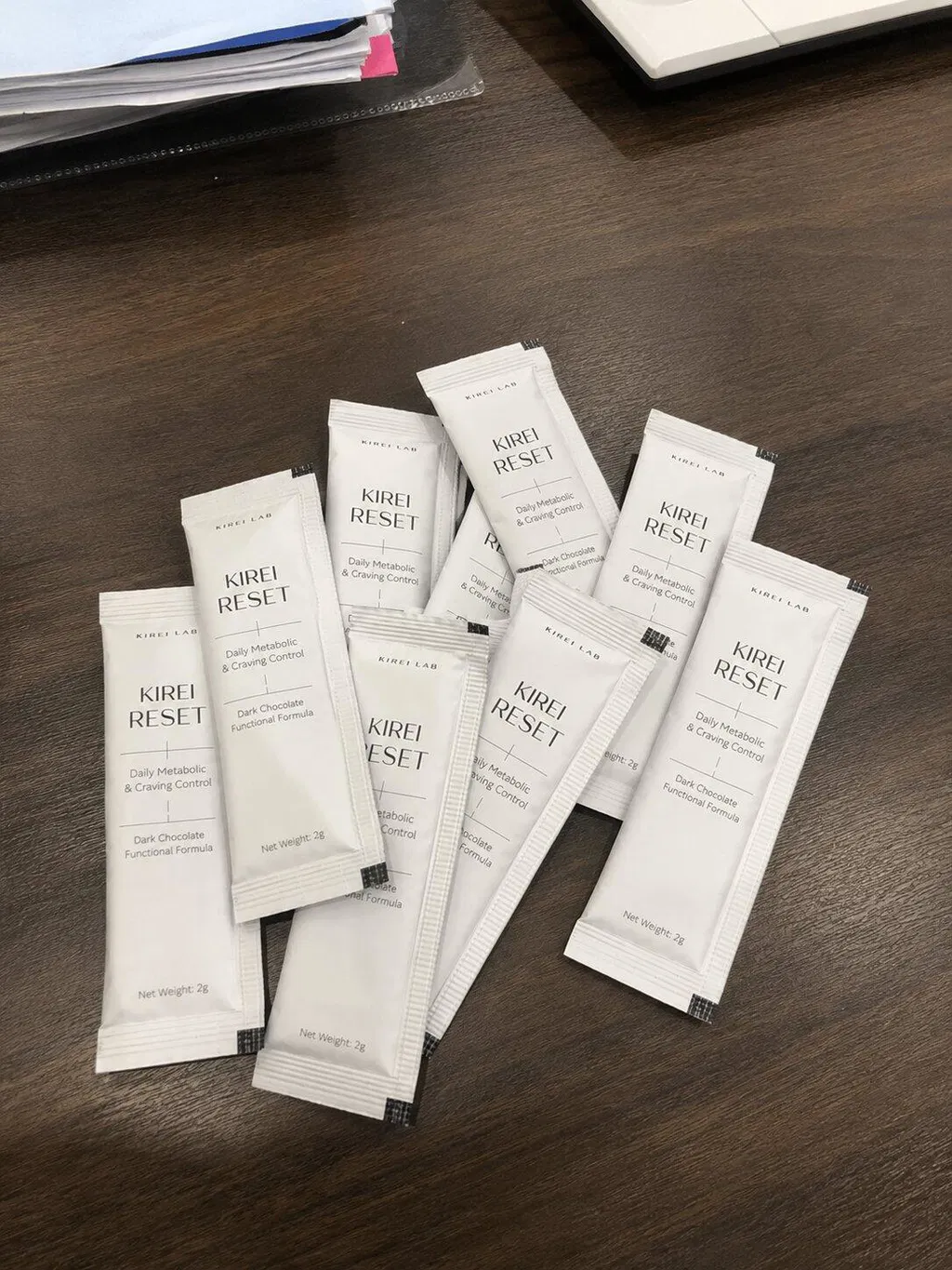 Seven KIREI RESET sachets arranged on a table